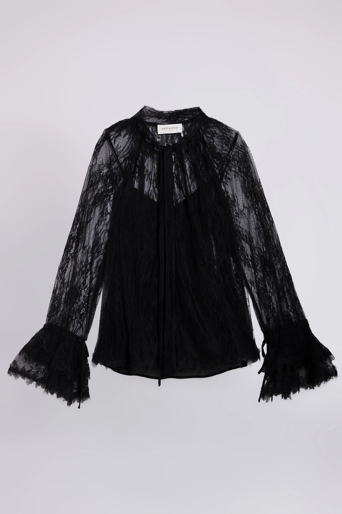Blusa de encaje con lazo y volantes
