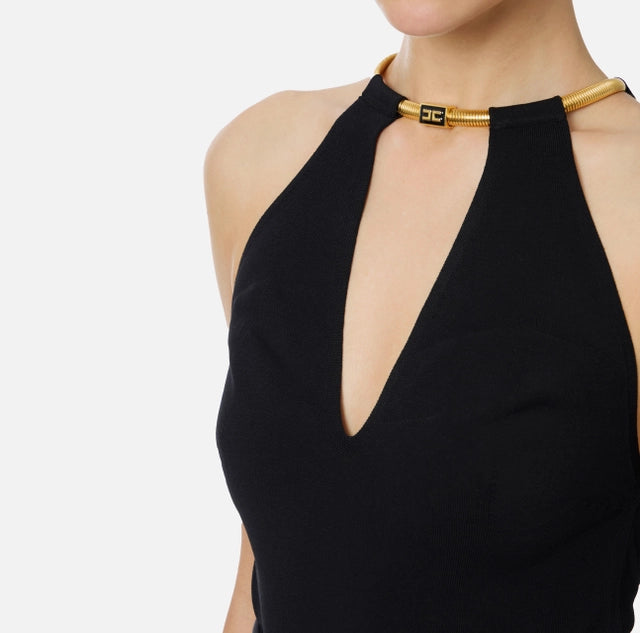 Top de punto con joya tipo snake