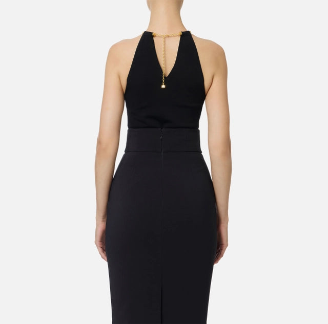 Top de punto con joya tipo snake